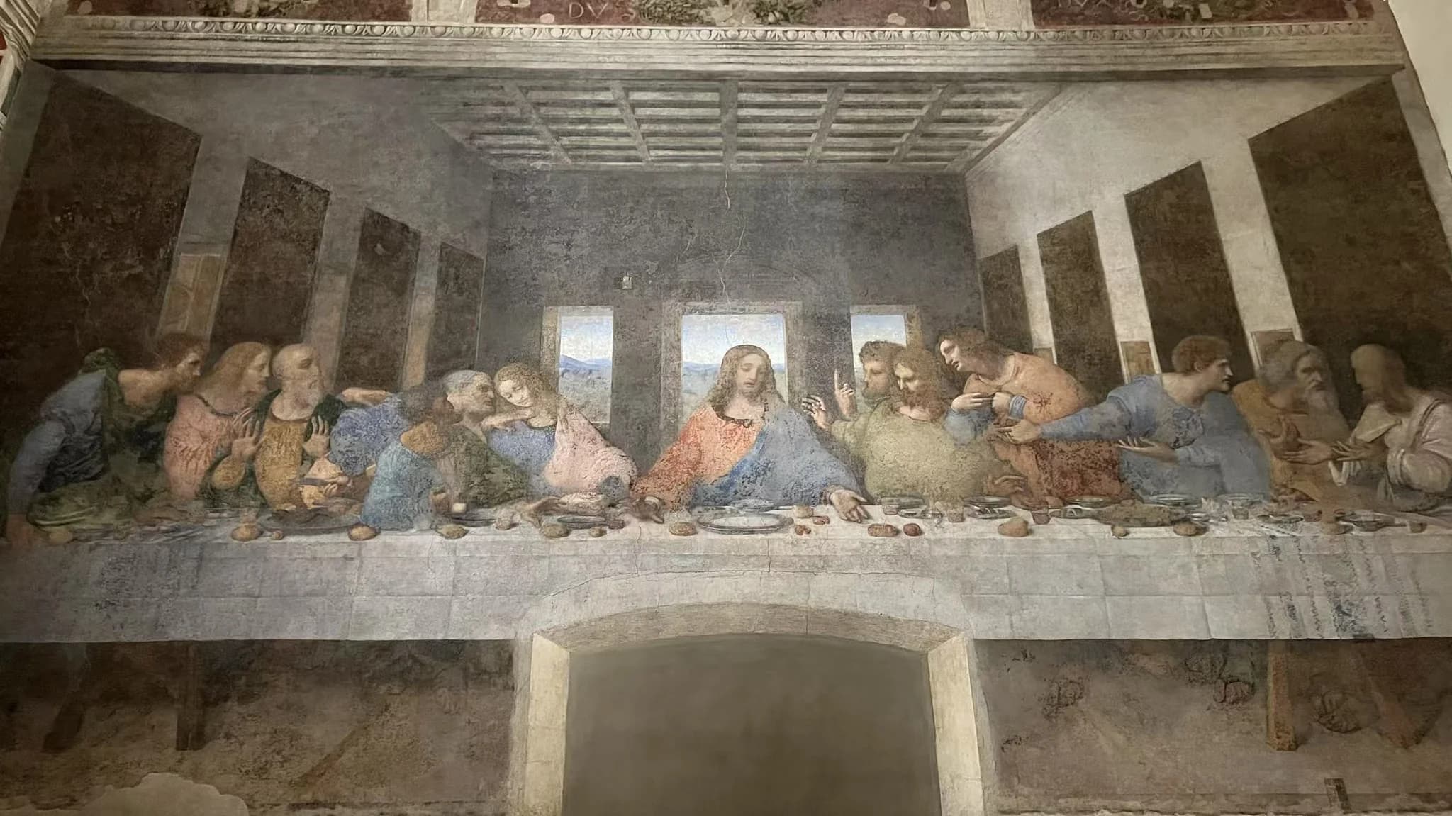 An on-site photograph of the complete Last Supper mural by Leonardo da Vinci